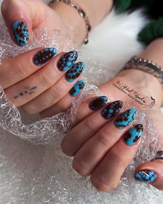 Almond nails with glossy turquoise and dark brown leopard-style spots